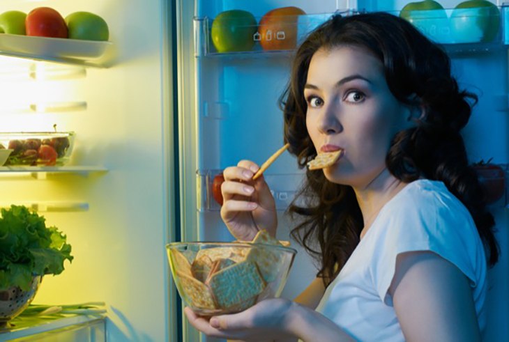 hungry-woman-at-fridge-nighttime-snack